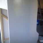First coat of primer on the cabinet